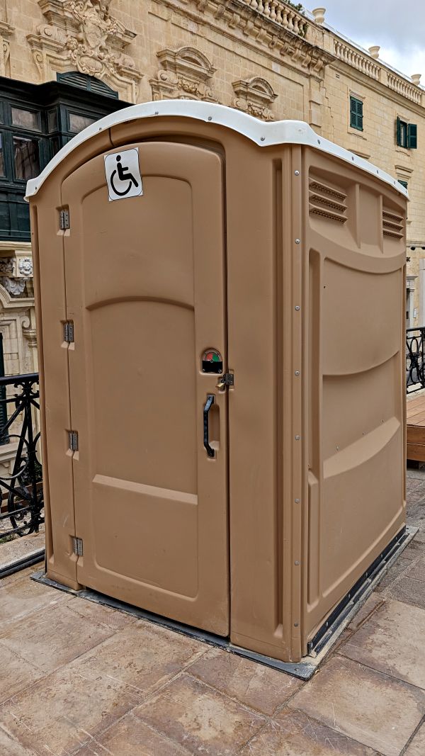 Commercial porta potty rental units at a business site in Southern California